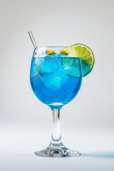 Glass of Blue Lagoon cocktail on a white background. 