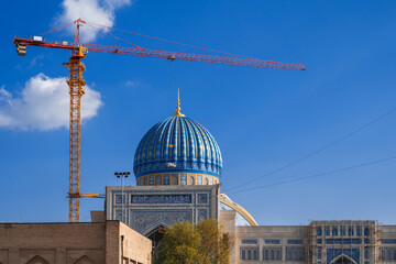 crane on a construction site is building a new large mosque Center of Islamic Civilization in Tashkent in Uzbekistan