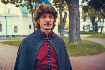 Portrait of a man in a medieval middle class costume. Retro style and historical clothes concepts