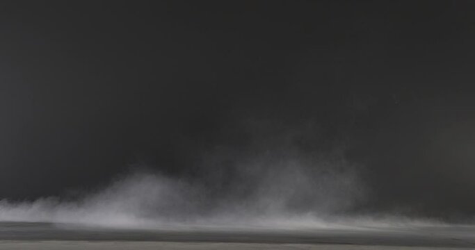 FX element of low-hanging, slowly moving smoke shot against black. Good, low-hanging mist effect. Resolution: 4096 x 2160 @ 24fps	