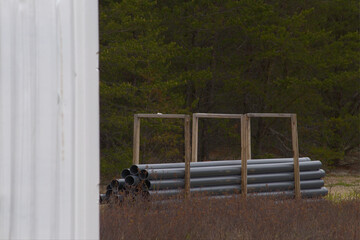 Plastic construction pipes inside wooden case