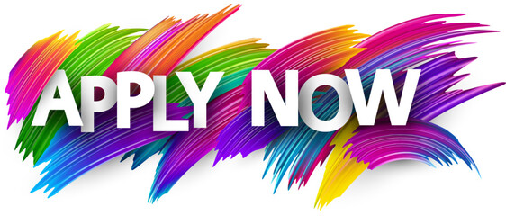 Apply now paper word sign with colorful spectrum paint brush strokes over white.