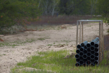 Plastic construction pipes inside wooden case