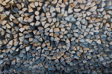 natural wooden background. firewood stacked on top of each other close-up 