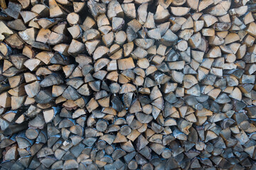 natural wooden background. firewood stacked on top of each other close-up 
