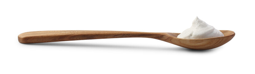 Wooden spoon with sour cream isolated on white