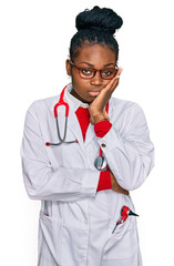 Young african american woman wearing doctor uniform and stethoscope thinking looking tired and bored with depression problems with crossed arms.