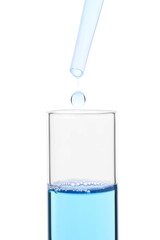 Dripping liquid from pipette into test tube isolated on white, closeup