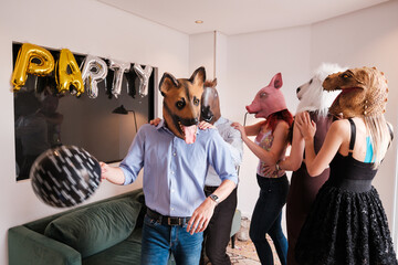 Group of friends with animal masks at a very peculiar party. Concept: fun, different, happy