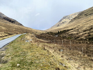 A view of the Scotland Countryside near the Glencoe Mountains on a sunny day