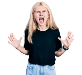 Young caucasian woman wearing casual clothes crazy and mad shouting and yelling with aggressive expression and arms raised. frustration concept.