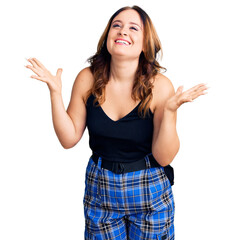 Young beautiful caucasian woman wearing casual clothes celebrating mad and crazy for success with...