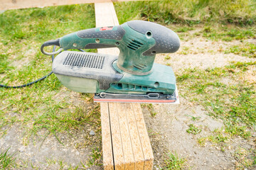 Electric Wood Planer hand held Green Machine. Planer close-up. Carpentry,