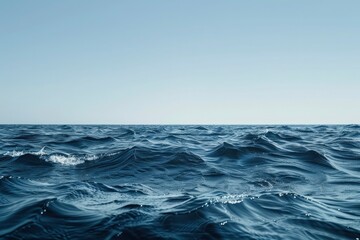 The vast ocean with rough waves with clear blue sky background