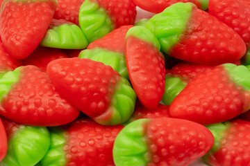 Jelly strawberry candies isolated on a white background. Top view. Delicious gelatin candies.