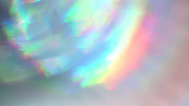 Multicolored iridescent rainbow light leaks blending into soft focus areas.