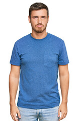 Fototapeta premium Handsome caucasian man wearing casual clothes depressed and worry for distress, crying angry and afraid. sad expression.