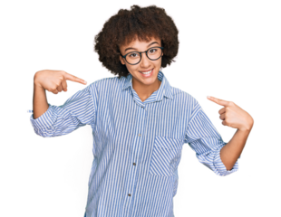 Young hispanic girl wearing business shirt and glasses looking confident with smile on face, pointing oneself with fingers proud and happy.