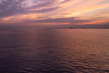 A ship is sailing on the Marmara sea at the sunrise