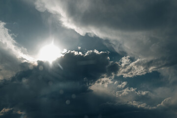 sunlight shining through the clouds in the sky
