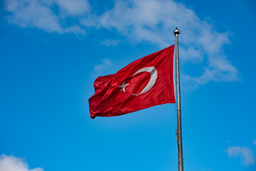 Turkish Flag waving in blue sky.
