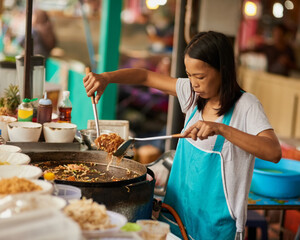 Woman, food market and cooking with vendor, ingredients and prepare meal with utensils, fried...