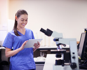 Girl, scientist and online on tablet in laboratory for daily schedule, biotechnology and experiment planning for research study. Woman, digital technology and internet for medical breakthrough.