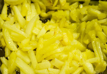 potatoes peeled into strips and fried