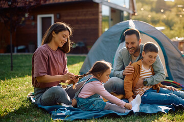 Happy family enjoying in camping day in springtime.