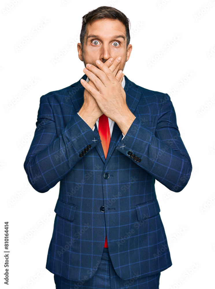 Canvas Prints handsome man with beard wearing business suit and tie shocked covering mouth with hands for mistake.