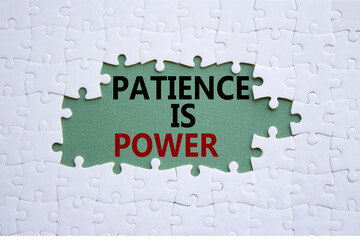 Patience is Power symbol. Concept words Patience is Power on white puzzle. Beautiful grey green background. Business and Patience is Power concept. Copy space.