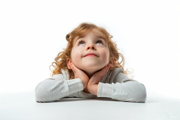 Young Girl Laying on Floor Looking Up