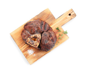 Piece of delicious grilled beef meat, thyme and salt isolated on white, top view