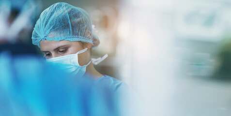 Health, surgery and doctor with face mask and scrubs in theatre for medical procedure and...