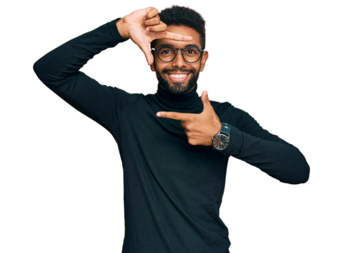 Young african american man wearing casual clothes smiling making frame with hands and fingers with happy face. creativity and photography concept.