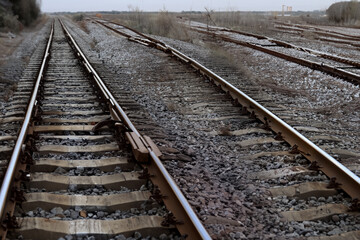 Fototapeta na wymiar Railway. Railroad tracks. Railway tracks in a sunny day, close-up view. Switch on train tracks. Old railway view.