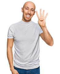 Naklejka premium Bald man with beard wearing casual white t shirt showing and pointing up with fingers number four while smiling confident and happy.