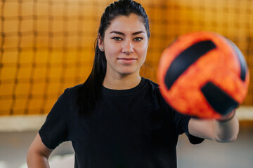 Cropped shot of a female volleyball player posing and looking at the camera