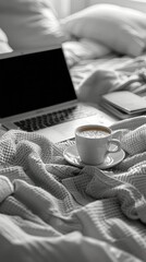 Laptop Computer on Bed With Coffee Cup