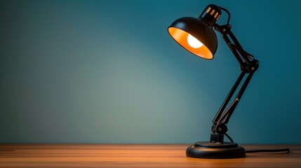 A minimalist office desk lamp casting a warm glow, highlighting the ample copy space in the background