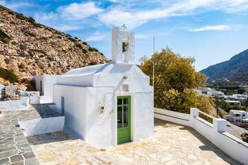 View of typical white small chapel in Kamares port, Sifnos, Cyclades Islands, Greece