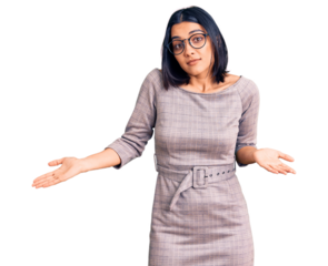 Young beautiful latin woman wearing casual clothes clueless and confused expression with arms and hands raised. doubt concept.