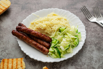 A delightful combination of creamy mashed potatoes with cheese, a crisp cabbage and cucumber salad,...