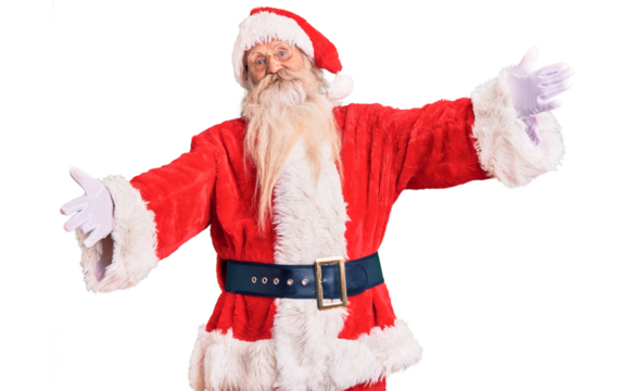 Old senior man with grey hair and long beard wearing traditional santa claus costume looking at the camera smiling with open arms for hug. cheerful expression embracing happiness.