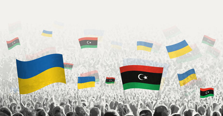 People waving flag of Libya and Ukraine, symbolizing Libya solidarity for Ukraine.
