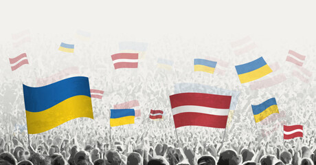 People waving flag of Latvia and Ukraine, symbolizing Latvia solidarity for Ukraine.