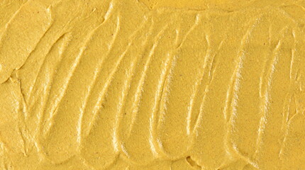 Yellow mustard sauce, spread background and texture, top view