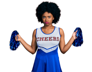 Young african american woman wearing cheerleader uniform using pompom skeptic and nervous, frowning upset because of problem. negative person.