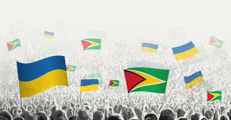 People waving flag of Guyana and Ukraine, symbolizing Guyana solidarity for Ukraine.