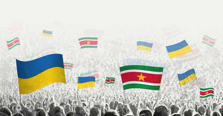 People waving flag of Suriname and Ukraine, symbolizing Suriname solidarity for Ukraine.